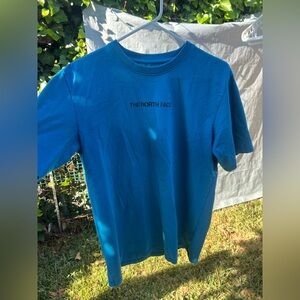 Blue North Face Short Sleeve Tee. Men’s Medium. In used condition.
